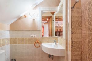 a bathroom with a sink and a mirror at La Casica del Sol in Requena +28 photos
