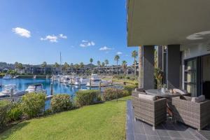a view of a marina with boats in the water at Villa One on the Waterways - Pool, Spa Pool, Tennis in Whitianga
