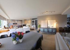 a large living room with a couch and a living room at Dream house with garden in Kalmar