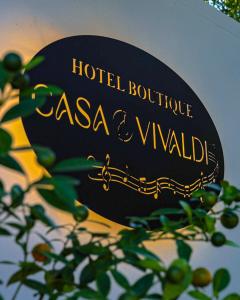 a sign for a hotel boutique asahi vivendi at Hotel Casa Vivaldi in Mérida +16 photos