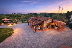 an overhead view of a house with a roof at Il Casale di Lucullo-Holiday Home with Pool and Spa- in Lucignano