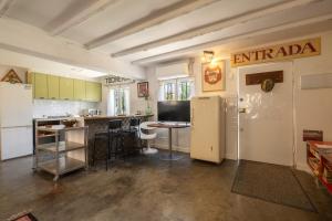 a kitchen with a refrigerator and a counter top at La Fabriqueta Apartament in Ríudecañas