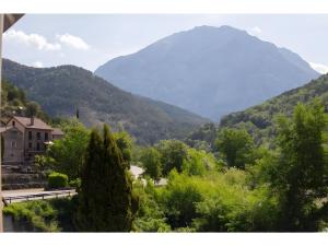 a view of a mountain with a road and trees at Nogal in Hospital