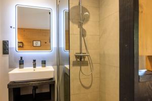 a bathroom with a sink and a shower at Le chalet Amélie in La Bresse +21 photos