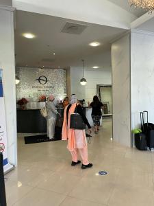 a group of people standing in a lobby with luggage at Apartments Miami in Sunny Isles Beach +36 photos