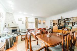 a living room with a table and a couch at El chalet El uncar in Castrejón de la Peña +23 photos