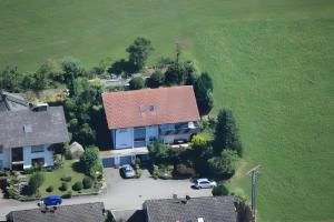 an overhead view of a house with a red roof at Ferienwohnung Ritter in Oberharmersbach
