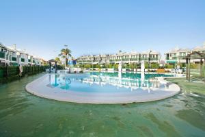 a large swimming pool at a resort with condos at Dunaflor Gemelo 2 in San Bartolomé