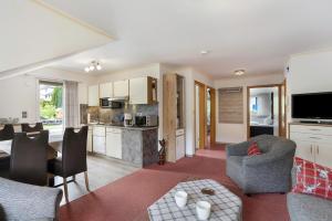 a living room with a kitchen and a dining room at Ferienwohnung Becker in Schwalefeld