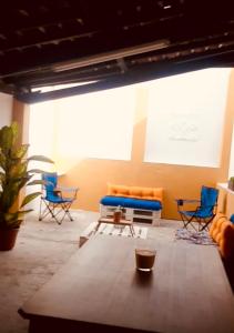 a room with chairs and a table and a screen at Casa Jubileu in Golegã