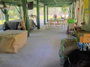 a room with a table and chairs in it at Rustic River Cabin in Branford