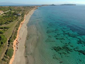 an aerial view of a beach and the ocean at Blue Horizon Sinis in Funtana Meiga