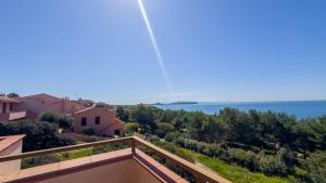 a view of the ocean from the balcony of a house at Blue Horizon Sinis in Funtana Meiga