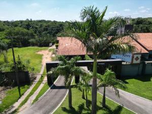 an aerial view of a house with palm trees at KANKUN MOTEL SOROCABA -Adult only in Sorocaba