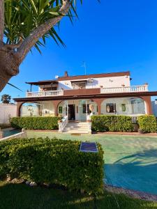 a house with a pool in front of it at Villa Martila in Bari