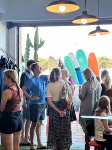 a group of people standing in a room with surfboards at Salty in Essaouira