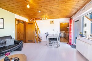 a living room with a couch and a table at Ferienwohnung Sonnenblick in Albstadt
