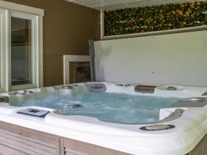 a bathroom with a bath tub with at Rustic & Charming Mont Blanc Chalet Private Spa in Saint-Faustin +121 photos
