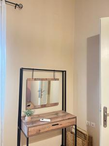 a mirror on a table in a room at Christi Iuxury Apartment in Preveza +39 photos