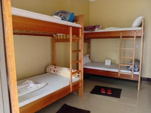 a group of bunk beds in a room at Kilimanjaro Budget in Moshi