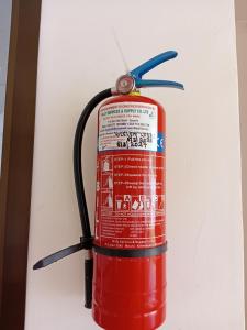 a fire hydrant is attached to a wall at Kilimanjaro Budget in Moshi