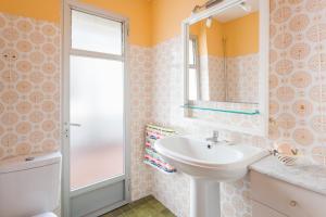 a bathroom with a sink and a mirror at La Matea in Llaurí +22 photos
