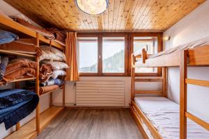 a room with bunk beds and a window at Appartement 22 - 5 personnes in Les Allues