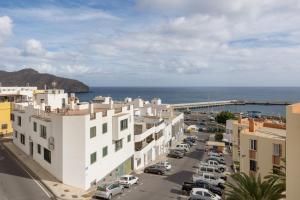 an aerial view of a city with buildings and the ocean at Edificio El Baifo Loco - Constantin in Gran Tarajal