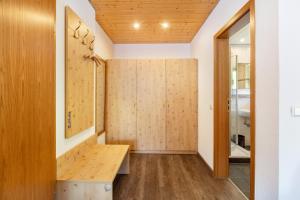a bathroom with wooden walls and a wooden bench at Glöcklehof in Todtnau +86 photos