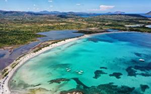 an aerial view of a beach with boats in the water at Villa Florida 2 with private pool in San Teodoro