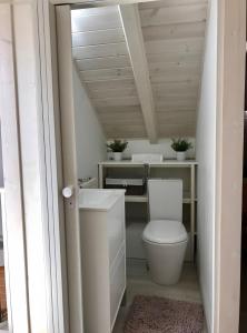 a bathroom with a toilet and a sink at Casa Sagres in Vila do Bispo +15 photos