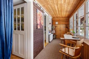 a room with a door and a table and chairs at Schwarzwaldcasa in Todtmoos