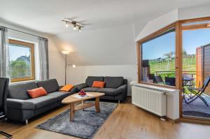 a living room with a couch and a table at Ferienwohnung Keller in Hagnau