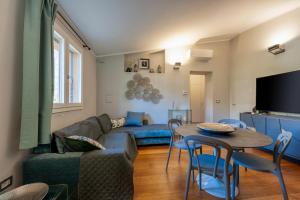 a living room with a couch and a table at Le dimore di Elia in Lecce