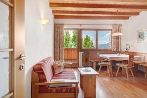 a living room with a couch and a table at Hofanger in Lagundo