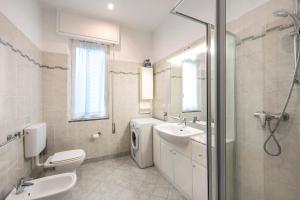 a bathroom with a sink and a toilet and a shower at Il Porto in Celle Ligure