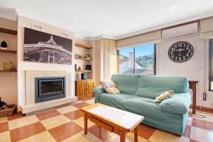 a living room with a couch and a fireplace at La bodegueta in Orba