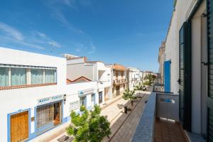 an empty street in a city with buildings at Da Giò, a due passi dal mare in Calasetta