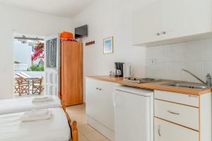 a kitchen with a sink and a counter top at Sifnos studio 5 in Sifnos