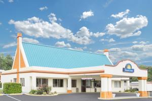 a rendering of a hospital building with a blue roof at Days Inn by Wyndham Ruther Glen Kings Dominion Area in Ruther Glen