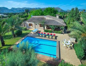 an aerial view of a house with a swimming pool at Villa Tancotes in Pollença