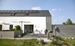 a house with solar panels on the roof at Charmingsuite in Bad Teinach-Zavelstein