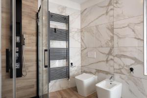 a bathroom with a toilet and a sink at Casa della Rosina in Bresimo +35 photos
