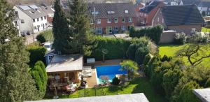 an aerial view of a house with a swimming pool at Maisonette-Wohnung in Gladbeck in Gladbeck