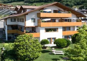 an apartment building with trees in front of it at Hofanger in Lagundo
