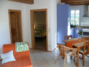 a kitchen and dining room with a table and chairs at Alte Wassermühle in Salem
