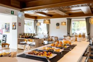 a buffet with several plates of food on a table at Ferienwohnung Sonneck in Natz-Schabs