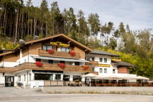 a hotel with flowers on the front of a building at Ferienwohnung Sonneck in Natz-Schabs