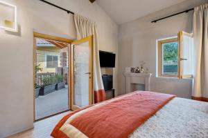 a bedroom with a bed and a large mirror at Decanter House in Borgomanero