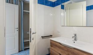 a bathroom with a sink and a mirror at Li Conchi 44 in Castiadas +21 photos